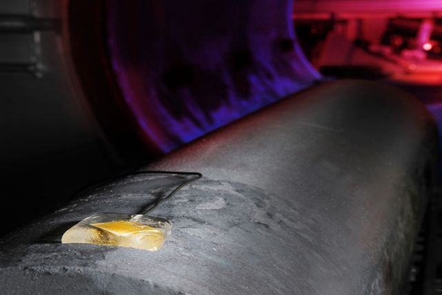 Transducer element embedded in glass solder on a steel tube